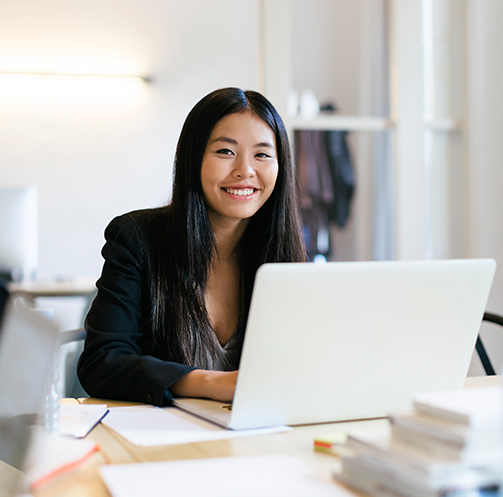 young-asian-woman-working-in-office-using-laptop-2022-01-18-22-43-35-utc